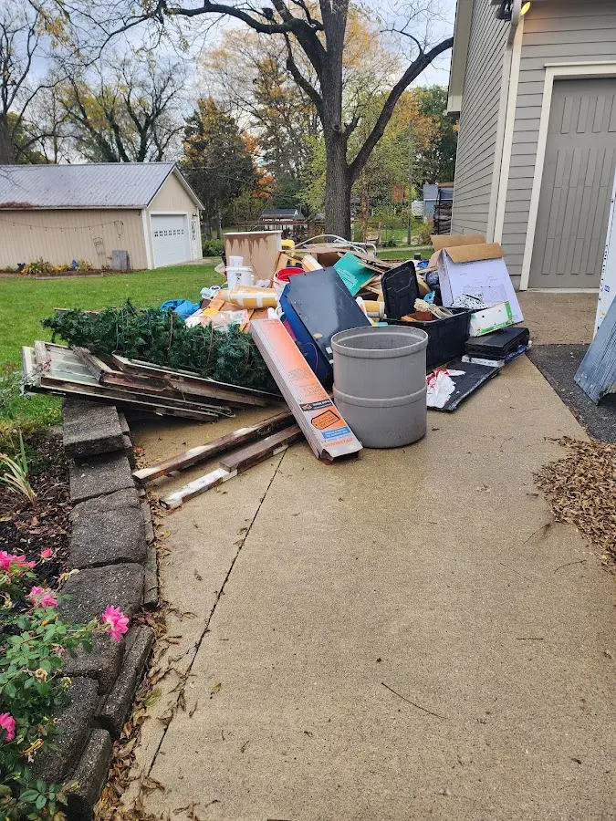 Dumpster being loaded with debris for Commercial Dumpster Rental in Fort Pierce North